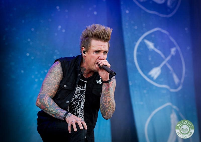 Jacoby Shaddix of Papa Roach singing on stage
