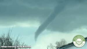 A funnel cloud in the sky.